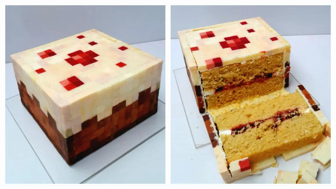 En Minecraft-inspirerad tårta med pixlad design, perfekt för ett Minecraft tårta recept. Den är skuren för att visa lager av saftigt bröd och sylt.