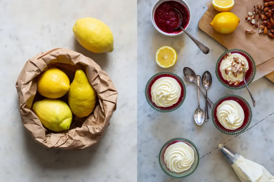 Färska citroner i en papperspåse bredvid färdiga citron dessert i glasbägare, toppade med vispgrädde och mandlar.